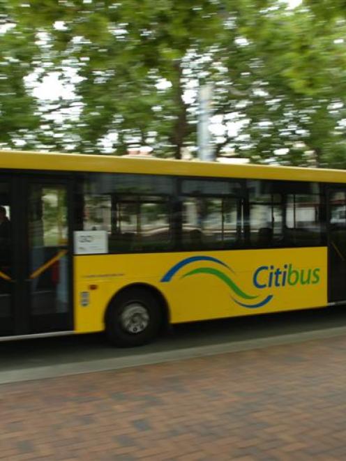 A city bus passes through the Octagon in Dunedin. Photo from ODT Files.
