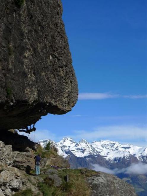 A climber hanging under the `Proud Monkey Roof' climbing route in Wye Creek. Photo by Guillaume...