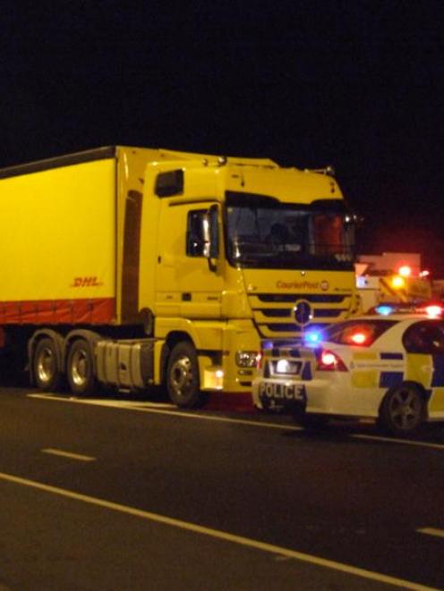 A CourierPost truck sits at the scene of a collision with two young women on Thames Highway on...