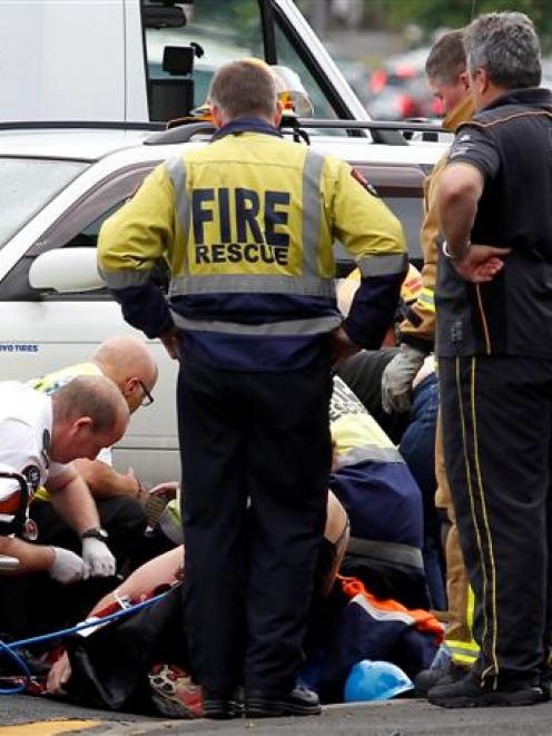 A cyclist broke her leg when she was trapped under a car. Photo / APNZ