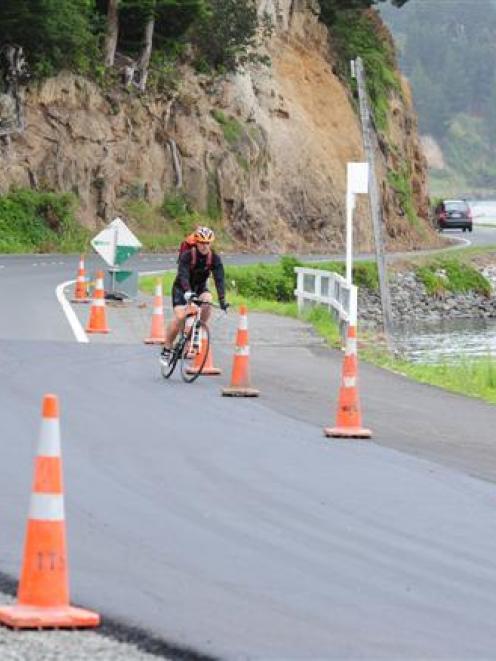 A cyclist negotiates a section of the Otago Peninsula cycleway under construction on Portobello...