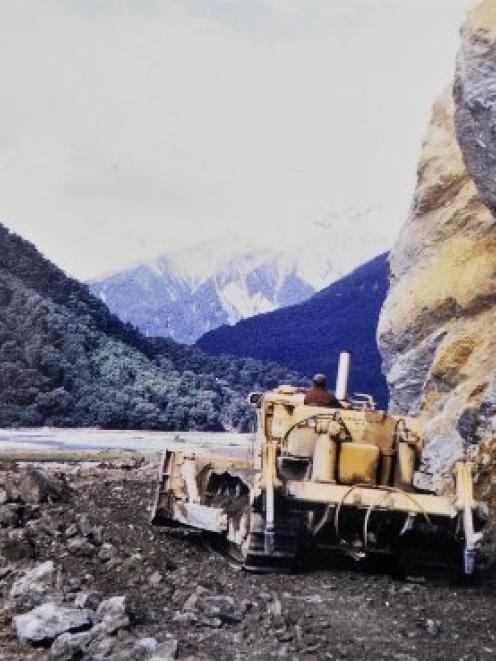 A D9 earthmover makes its way around Clarke Bluff in the 1950s. Photo  supplied by Tas Smith.
