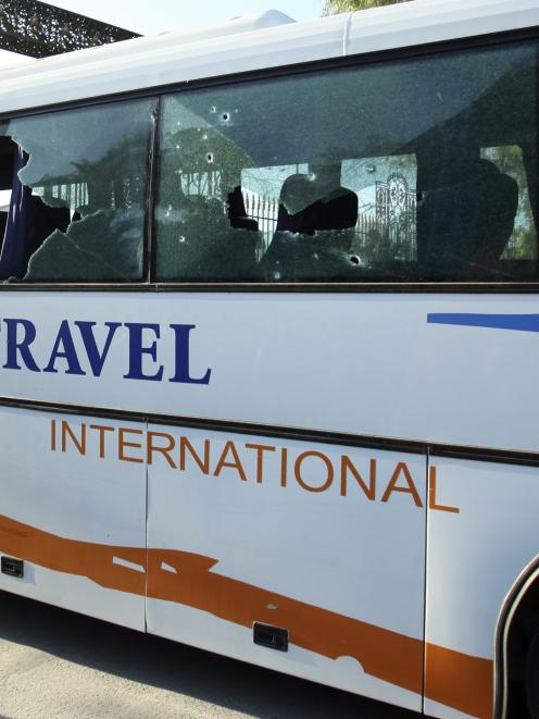 A damaged bus is seen after an attack by gunmen on Tunisia's national museum. Photo by Reuters.