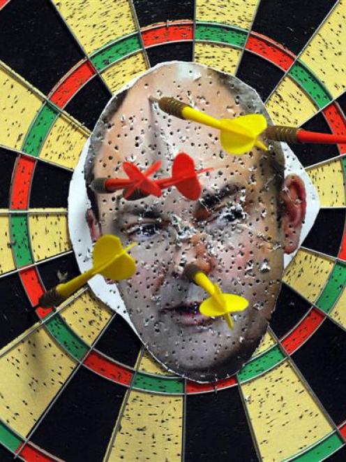 A dart board featuring an image of Minister for Tertiary Education Steven Joyce. The dart board...