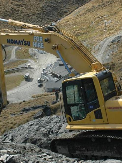 A digger works on improvements to the Waterfalls Trail in Shadow Basin at the Remarkables...
