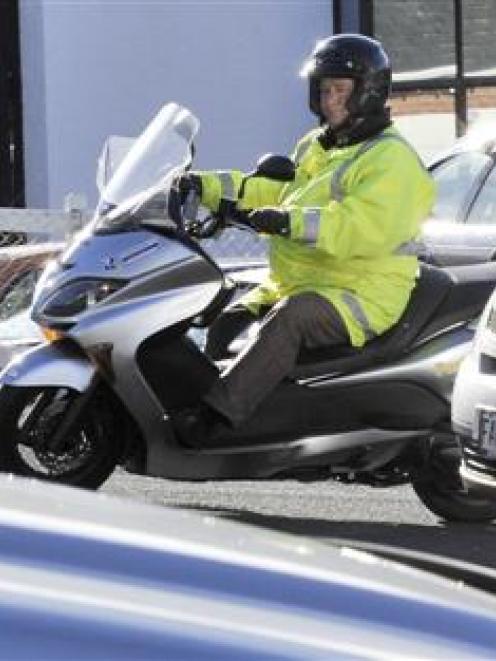A Dunedin City Council parking officer patrols the upper Moray Pl car park. Photo by Gerard O'Brien.