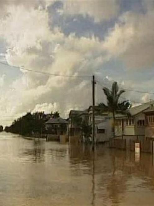 A flooded street in Rockhampton is seen in this image made from AuBC video. (AP Photo/AuBC via...