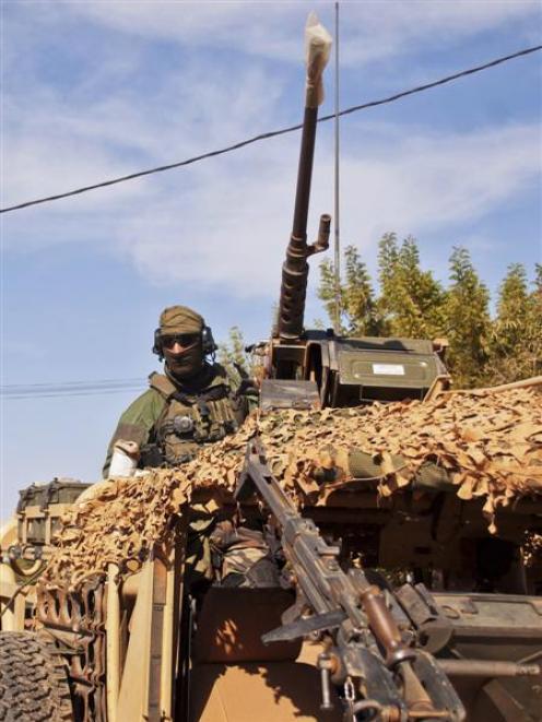 A French elite special operations soldier drives towards the Malian  capital  of Bamako to meet...