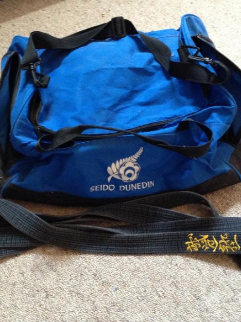 A gear bag and black belt similar to the ones stolen.