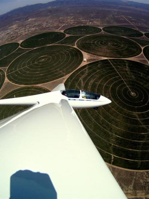 A glider crosses fields irrigated by centre pivots over Minden, western Nevada. Photo supplied.