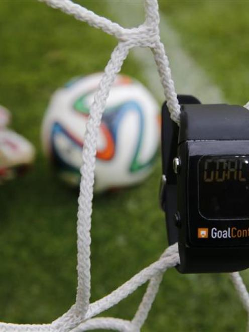 A GoalControl watch reads ''goal''  as a football rolls fully behind the goal line during a...