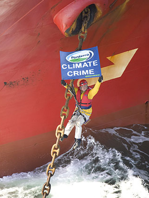 A Greenpeace protester on the Tauranga-bound ship this morning. Photo by Greenpeace