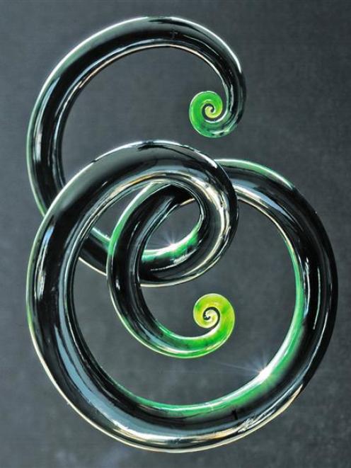 A greenstone "tendril" created by West Coast jade sculptor Ian Boustridge. When struck, the...