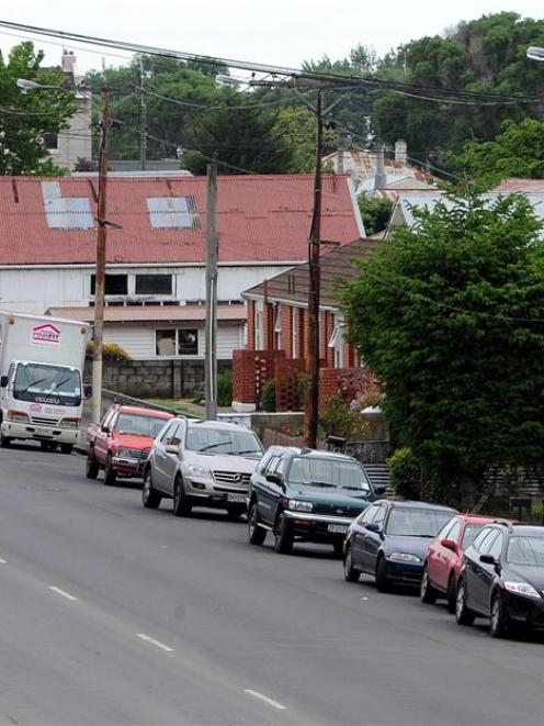 A group of houses in Burns St, across the road from the Carisbrook stadium, put up for sale by...