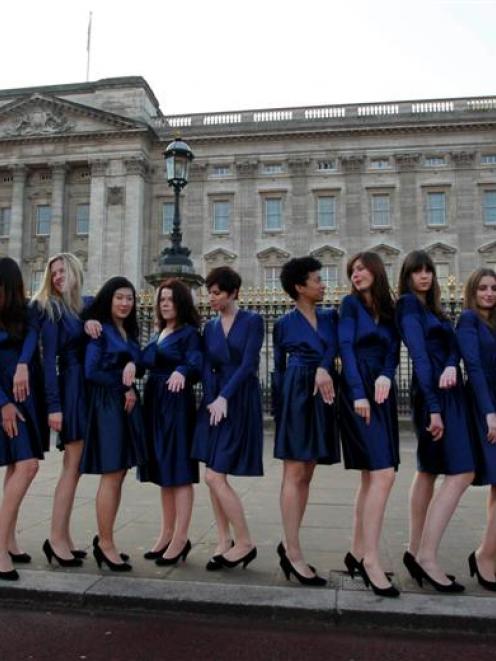 A group of students from the Royal College of Art pose for photographs wearing Kate Middleton...