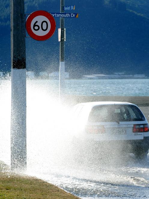 A high tide of 2.4m causes flooding on the corner of Portsmouth Dr and Teviot St at lunchtime...