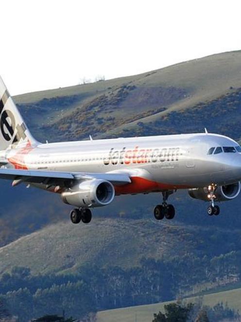 A Jetstar Airbus A320  flies into  Dunedin International Airport.  Net migration is at its...