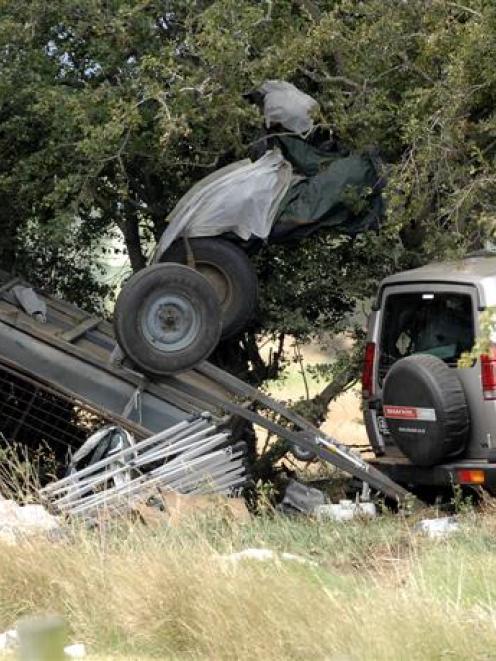 A Land Rover Discovery and trailer at the crash site. The upturned trailer was carrying a large...