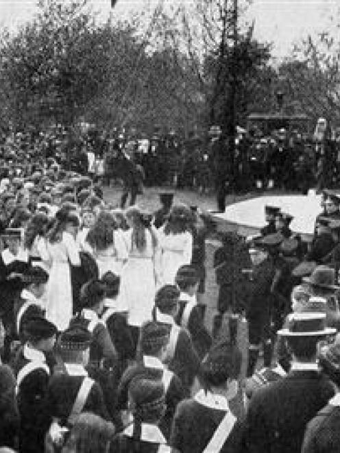 A large gathering at the Triangle, Dunedin,  for the saluting of the flag on Trafalgar Day. -...