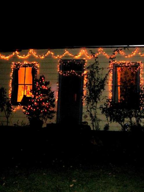 A Lawrence cottage owned by Kirsty Garner, illuminated as part of the mid-winter Light Up Your...