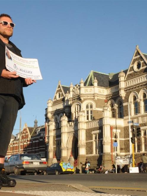 A man calling himself "Mr Grass" protests outside the Dunedin law courts building. Photos by...