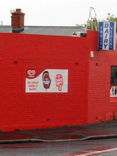 A man wielding a hammer demanded money from the owner of the Pine Hill Dairy in Dunedin on Sunday...