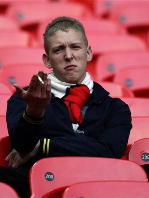 A Manchester United fan reacts after the team's 1-0 FA Cup semifinal loss to Manchester City at...