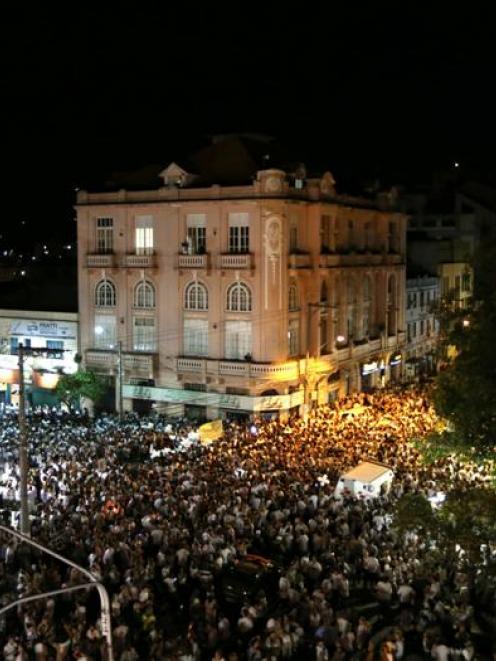 A march held in tribute to the victims of the Kiss nightclub fire. REUTERS/Stringer