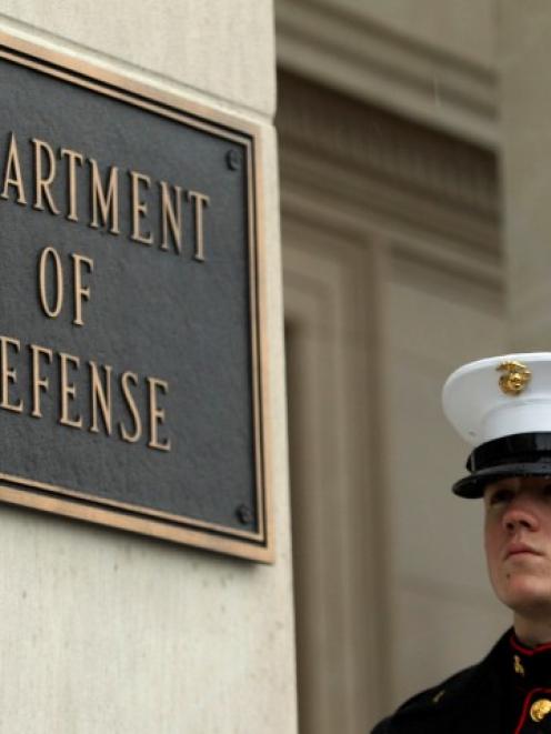 A marine stands guard outside the Pentagon in Washington. Photo Reuters