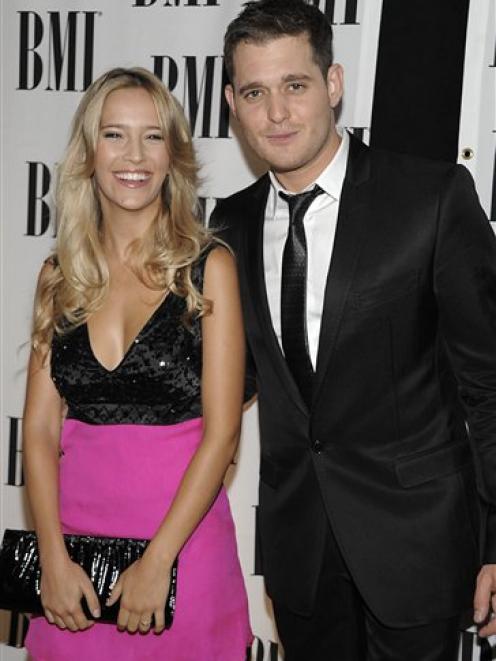 A May 2009 AP file photo shows singer Michael Buble, right, and his girlfriend, actress Luisana...