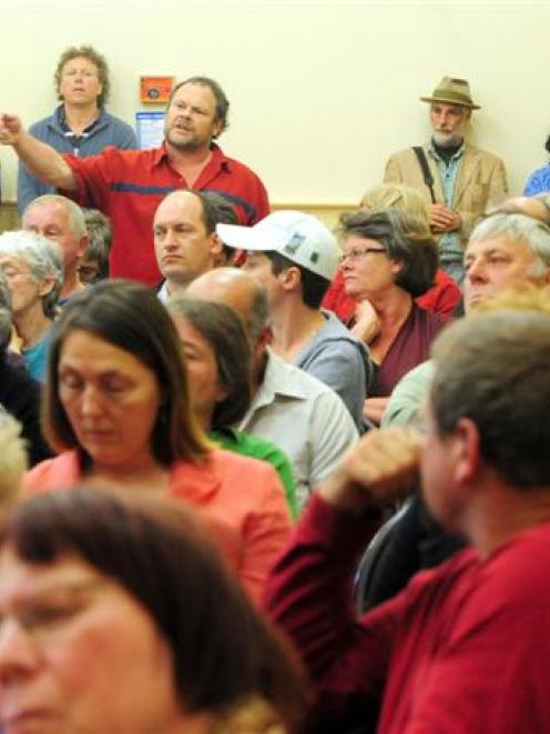 A member of the crowd argues against the stadium project. Photo by Craig Baxter.