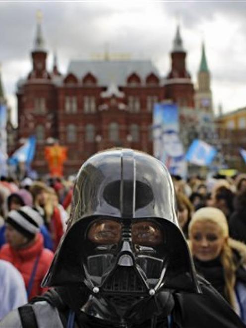 A member of the pro-Kremlin youth movement Stal (Steel) wearing a Darth Vader mask participates...