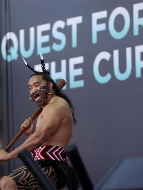 A member of the Te Waka Huia group from New Zealand performs during a ceremony officially opening...
