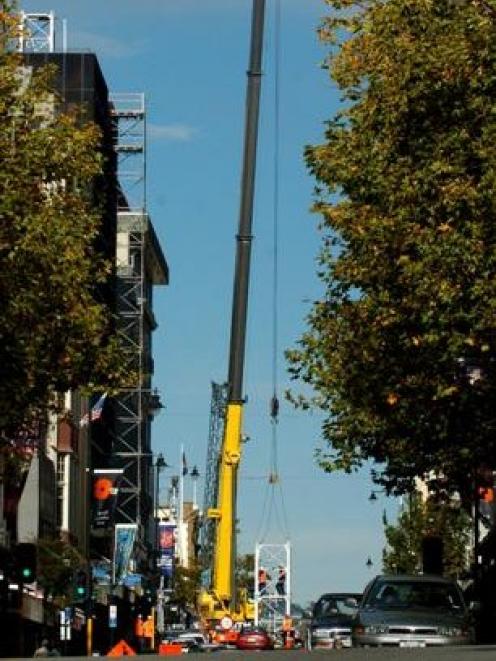 A mobile crane is used to assemble a construction crane at Otago House in Princes St, Dunedin,...