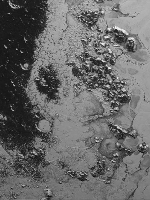 A newly discovered mountain range lying near the southwestern margin of Pluto's Tombaugh Regio ...