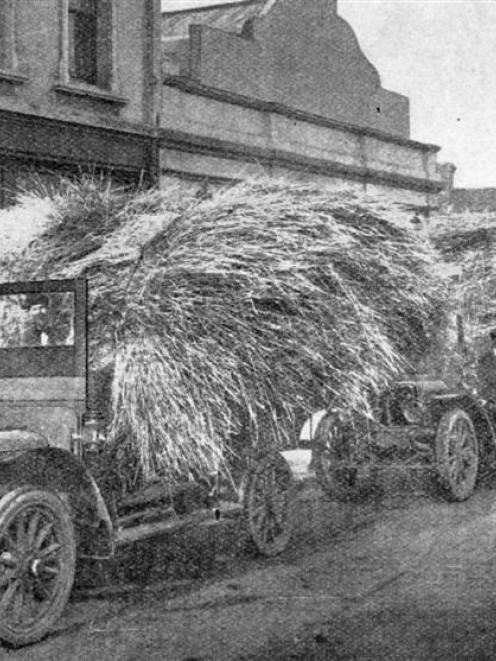 A novel method of cartage: loads of straw totalling 21 tons were carted to Dunedin by car from...