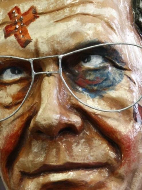 A papier mache figure for a carnival float depicting German President Christian Wulff as a...