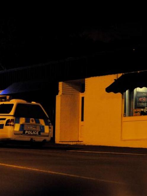 A police dog-handler's van outside the Normanby Tavern,  Dunedin, following an armed robbery last...
