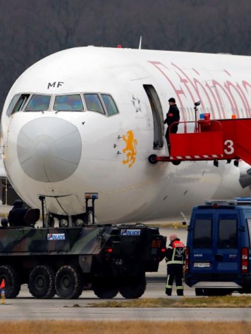 A police vehicle is stationed in front of the hijacked Ethiopian Airlines flight ET 702 after...