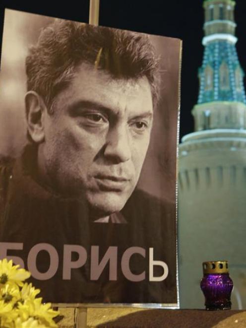 A portrait of Russian politician Boris Nemtsov is placed at the site where he was killed in front...