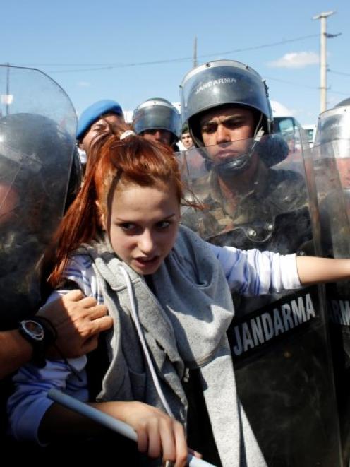 A protester stands against Turkish soldiers during clashes near Silivri, before a hearing on...