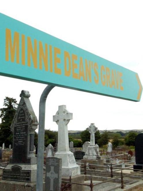 A recently-erected sign points towards Minnie Dean's grave in the Winton cemetery. The sign was...
