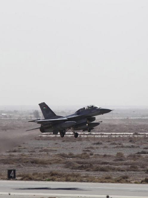 A Royal Jordanian Air Force plane takes off from an air base to strike the Islamic state in the...