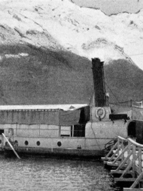 A scene at Glenorchy at the head of Lake Wakatipu: the ferry steamer unloading cargo. — Otago...