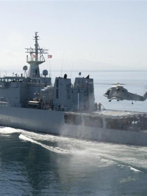 A Seasprite helicopter lands on  HMNZS Otago last year. Photo by RNZAF.