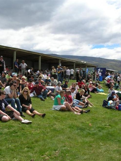 A section of the crowd enjoys the annual harness racing meeting at Roxburgh yesterday. Photo by...