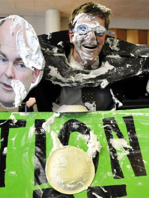 A shaving-cream pie-covered Logan Edgar, president of the Otago University Students' Association,...
