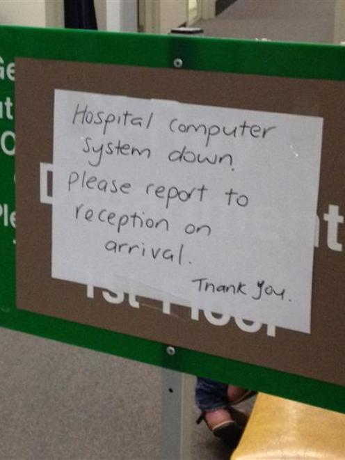 A sign at Dunedin Hospital advises that the SDHB computer system is down. Photo by Shawn McAvinue.
