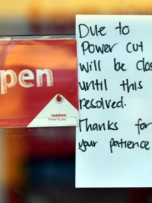 A sign on the window of Vodafone's central Dunedin business yesterday afternoon. Photo by Peter...