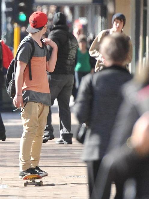 A skateboarder makes his way down George St, in Dunedin. Photo by Craig Baxter.